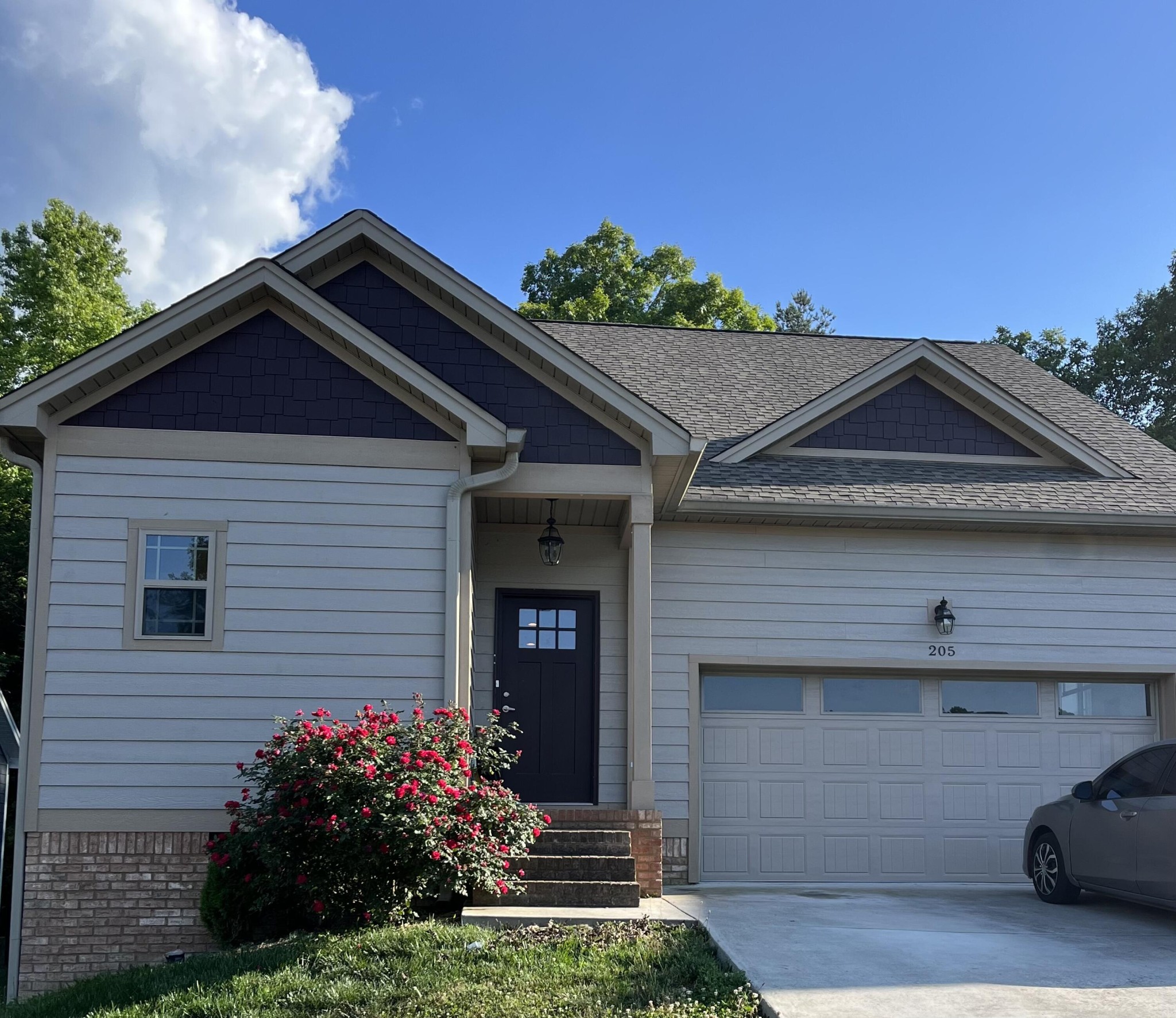 a front view of a house with a yard