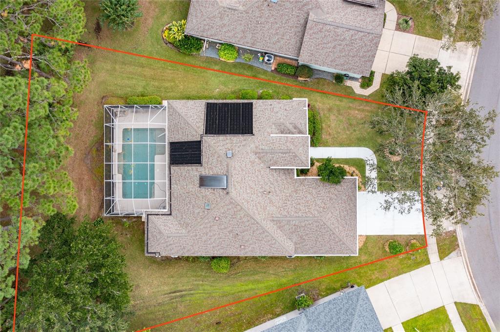 an aerial view of a house with swimming pool