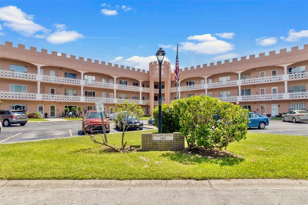 a view of a building with a yard