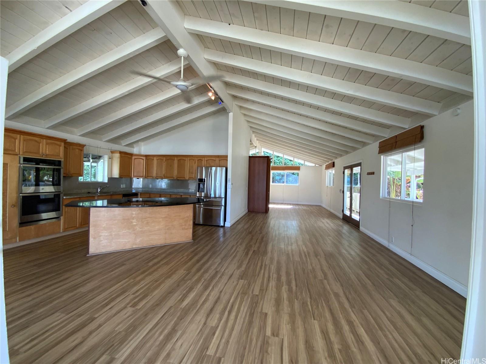 a view of kitchen with cabinets and wooden floor