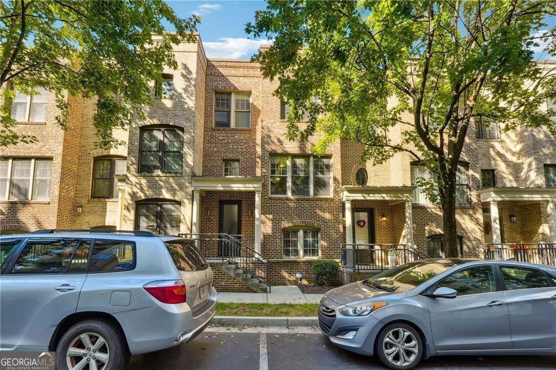 a front view of a house with parking space