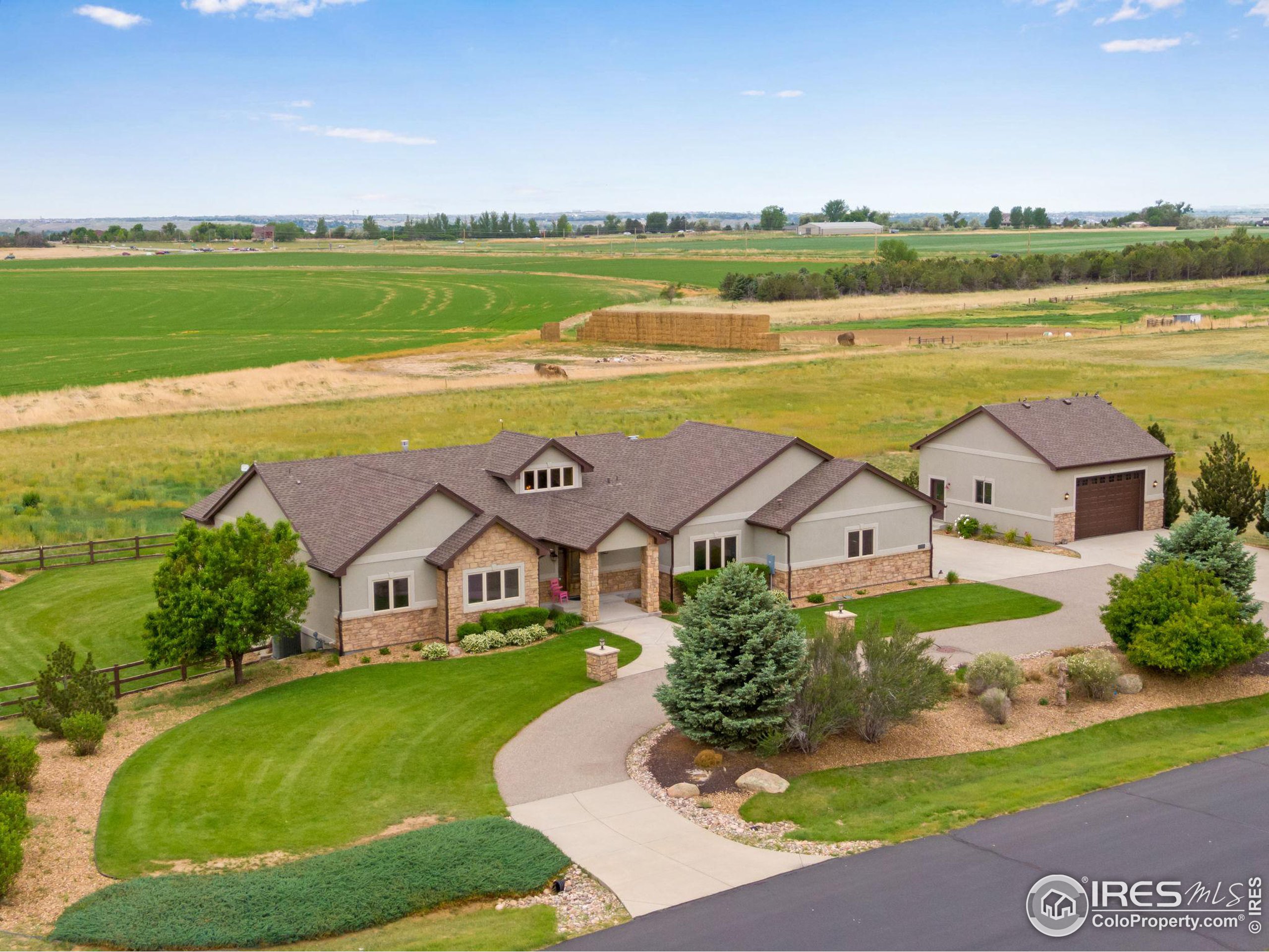 an aerial view of residential houses with outdoor space and river