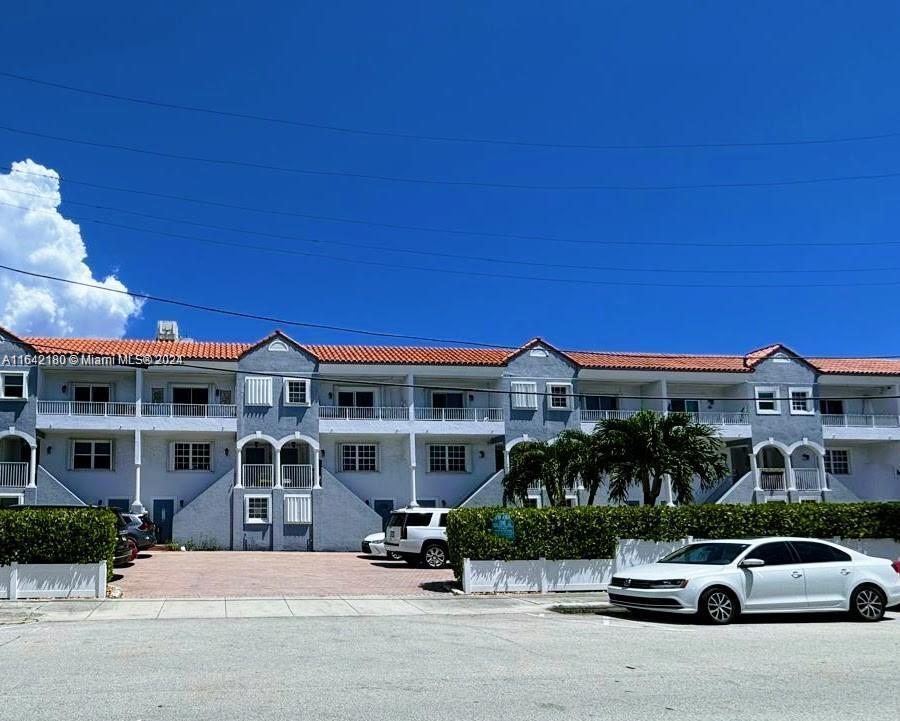 a car parked in front of a house