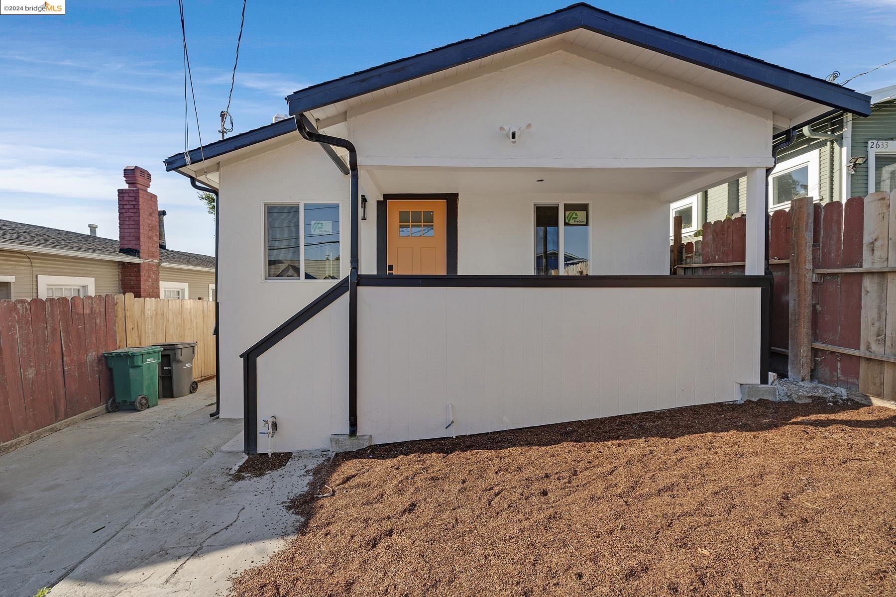 a house view with a wooden deck