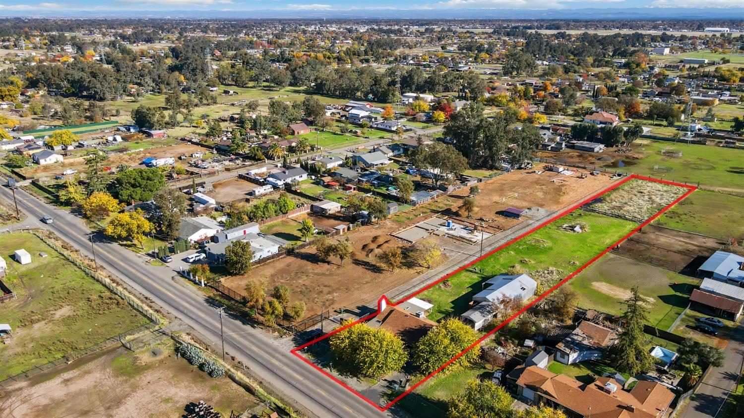 an aerial view of residential houses with outdoor space