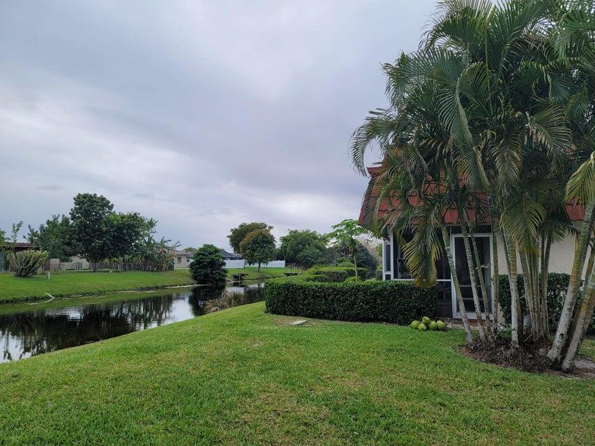 a view of a garden with a building in the background