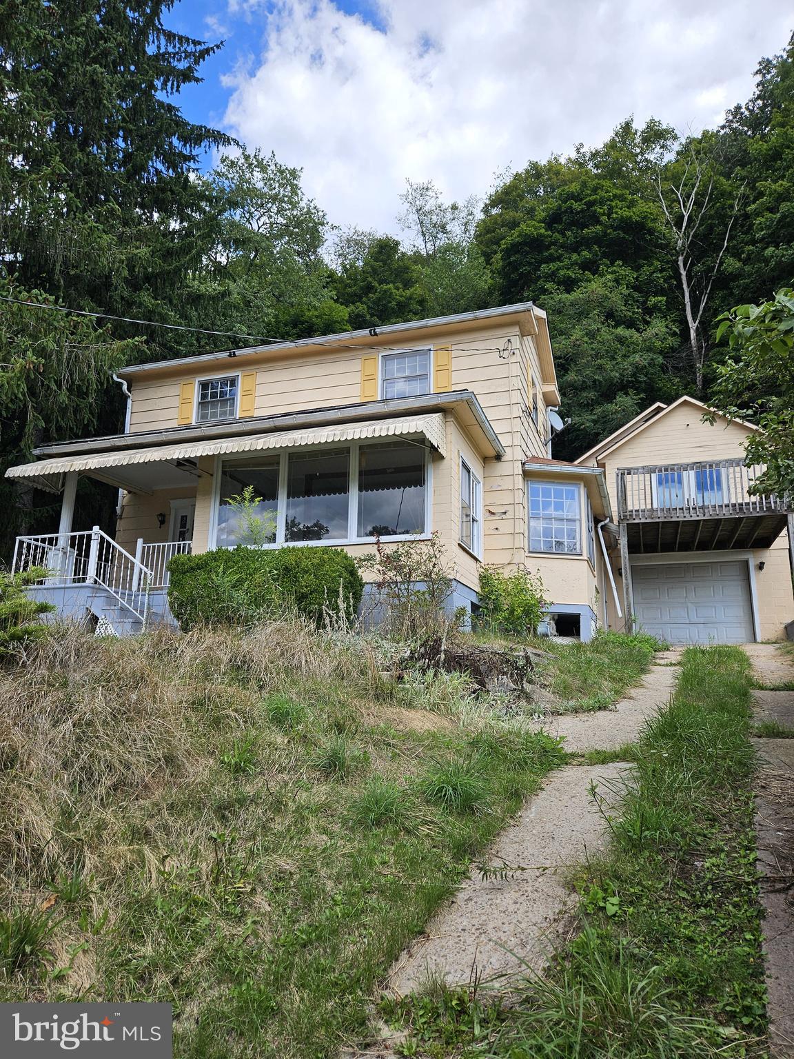 an aerial view of a house with a garden