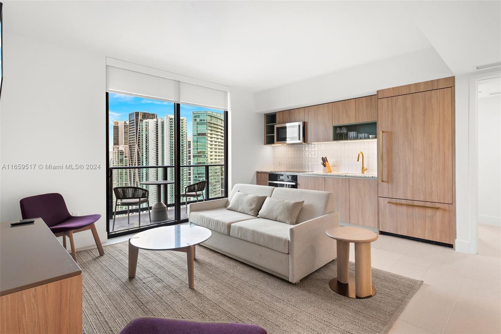 a living room with furniture a rug and a table