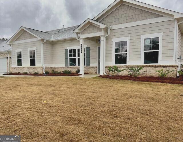 a front view of a house with a yard