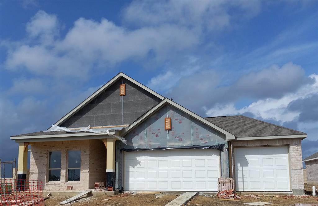 a front view of a house with garage