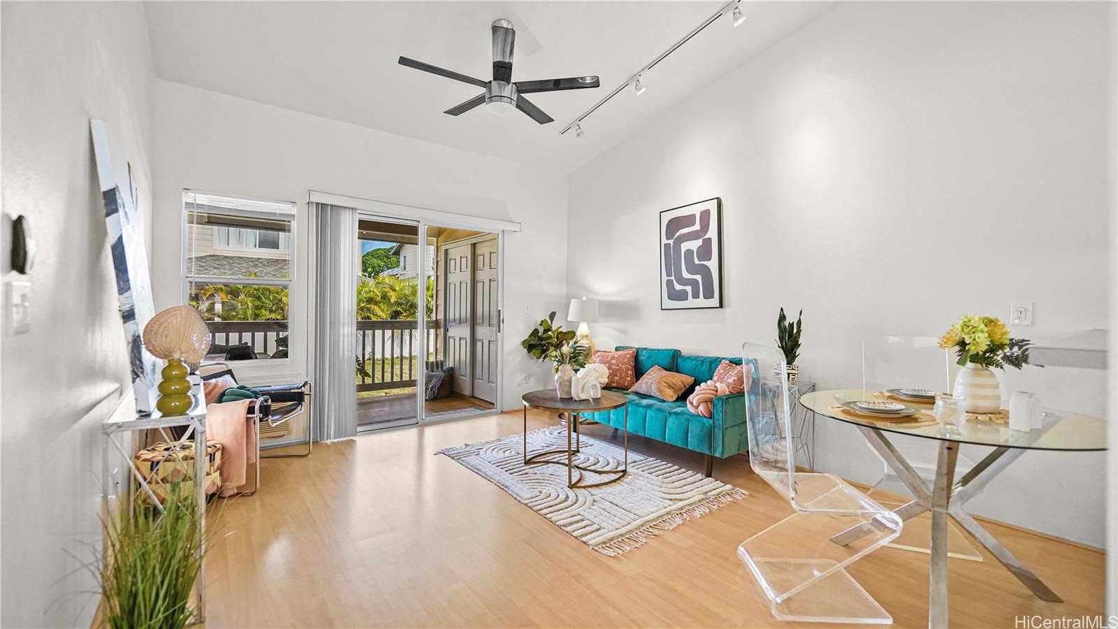 High ceiling living giving you a sense of space dining, and lanai. Brand new ceiling fan.