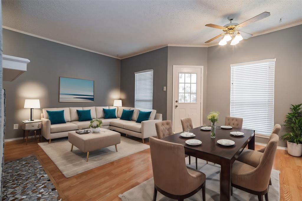 a living room with furniture two lamps and a large mirror