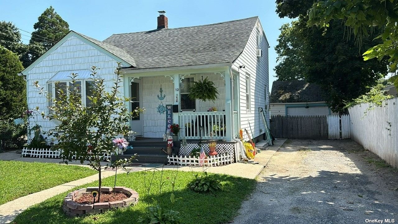 a front view of a house with a yard and fountain