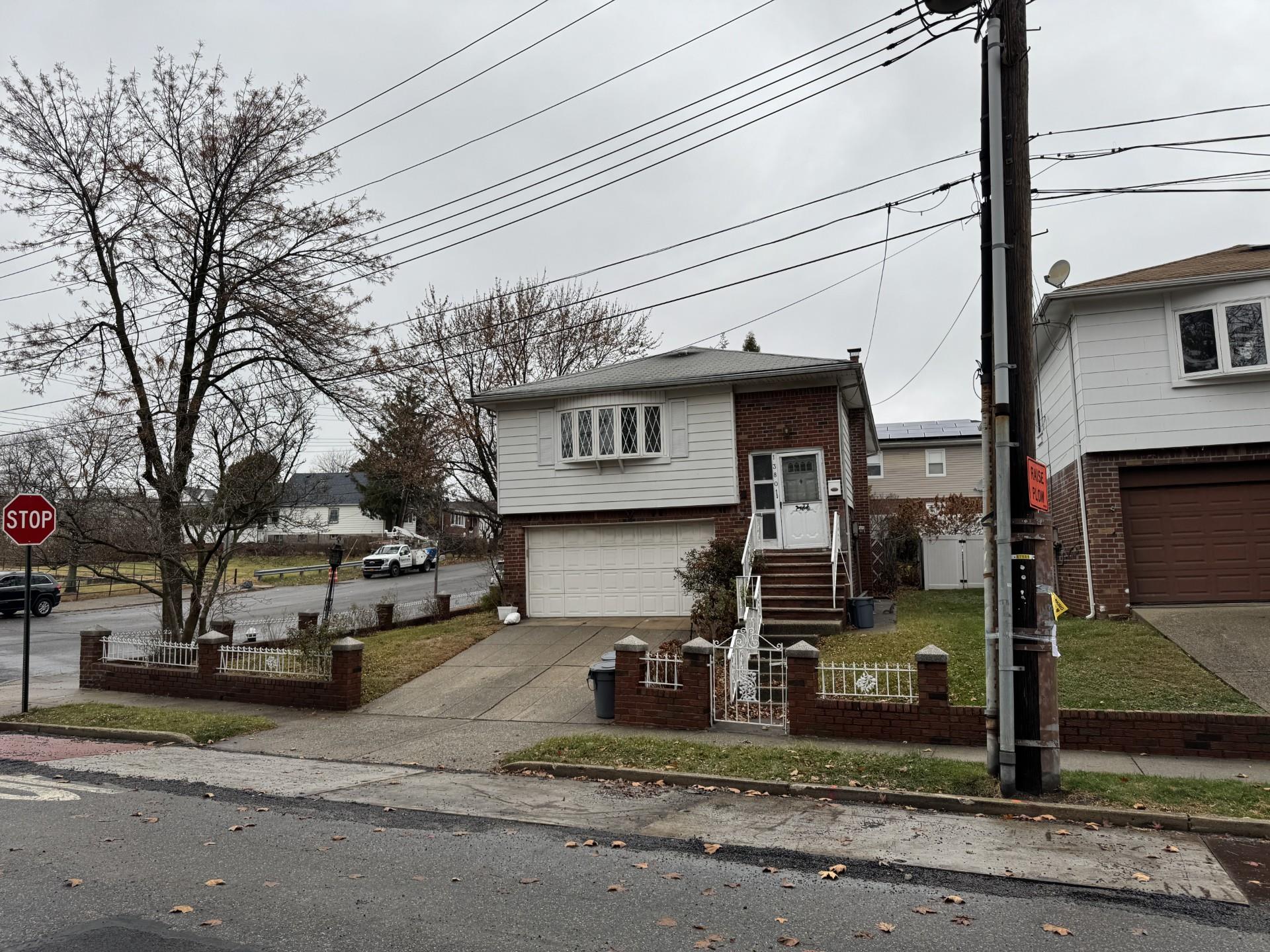 View of front of property featuring a garage