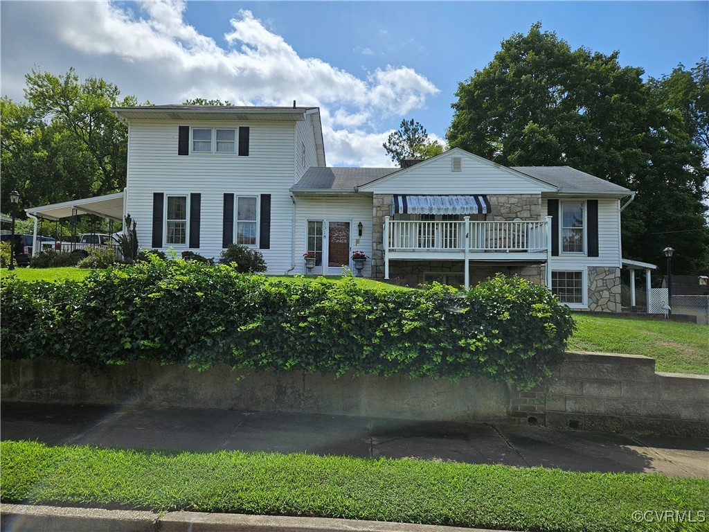 View of front of house with a balcony