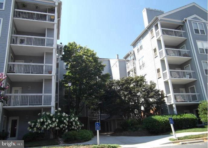 a view of front a building and trees