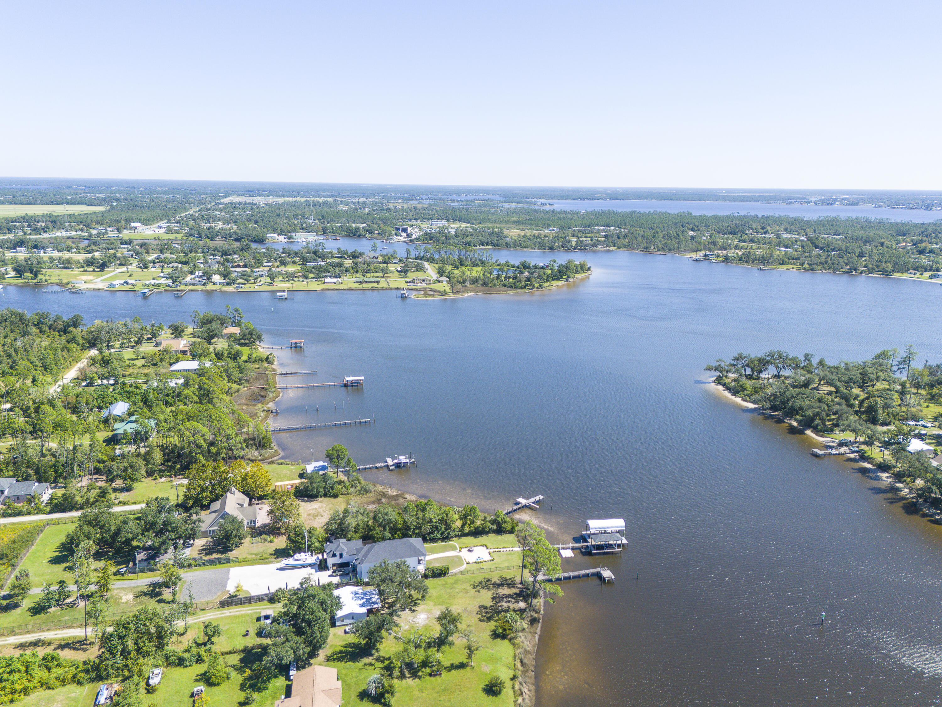 an aerial view of a house with a lake view