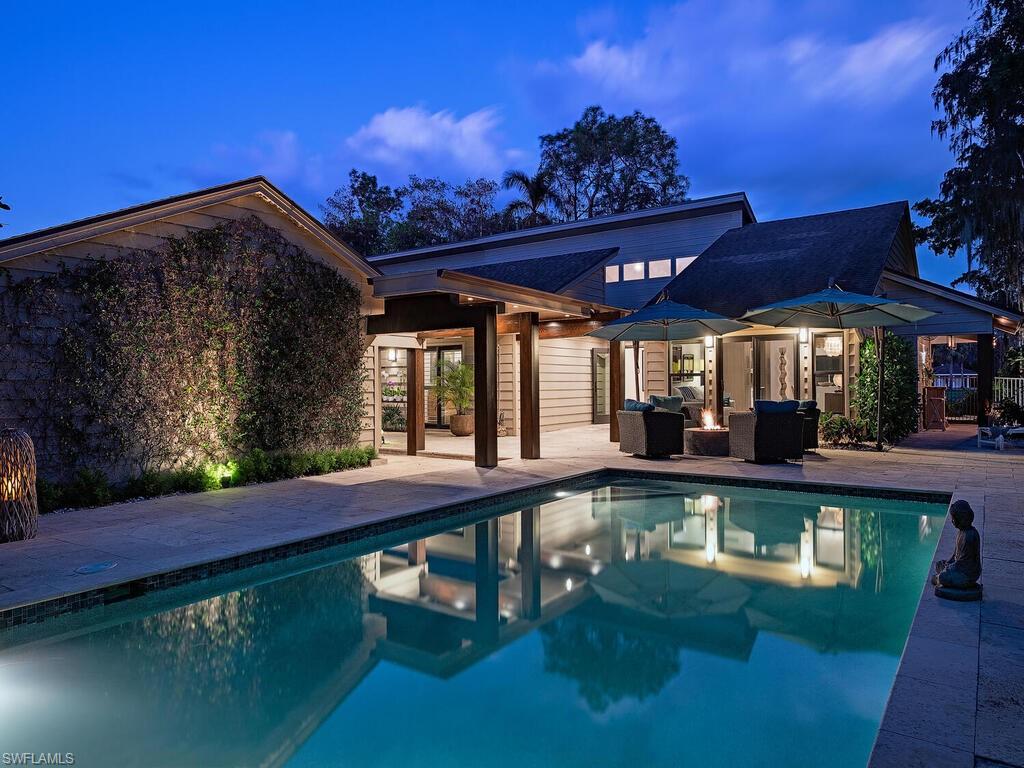 a view of a swimming pool with a patio