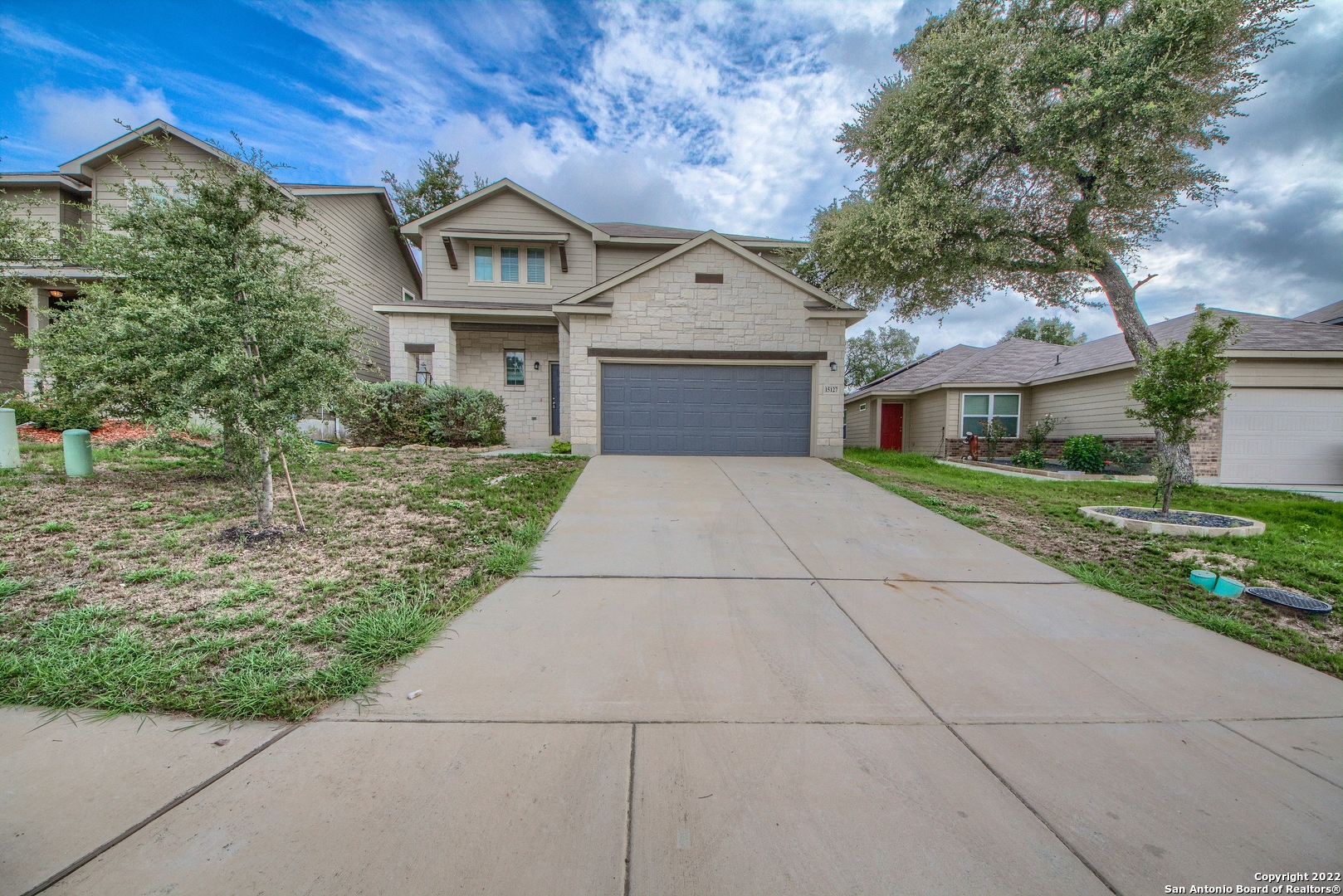 a front view of a house with a yard