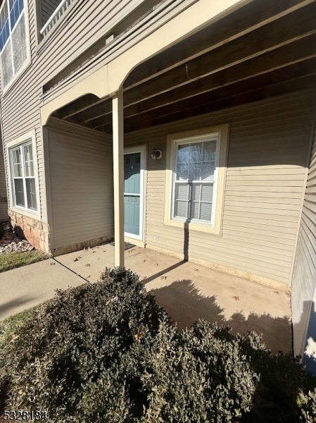 a view of a house with a small yard