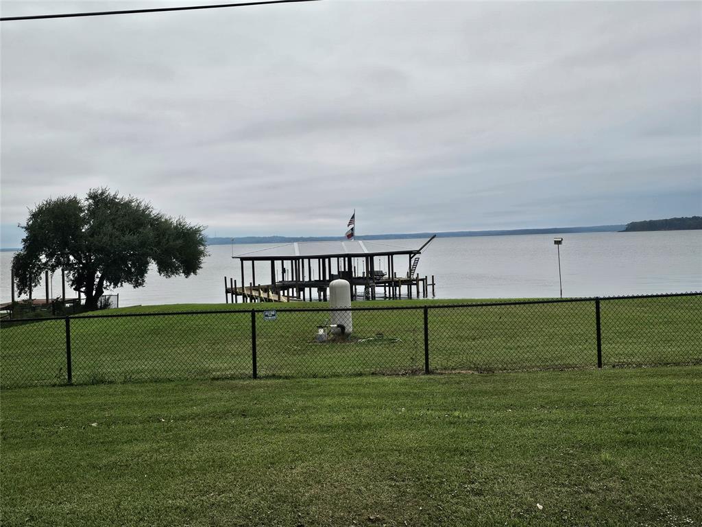 a view of park with bench and trees