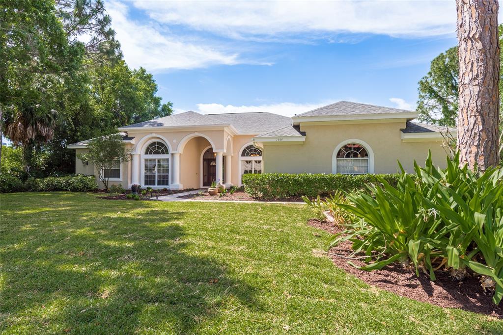 The inviting front entrance of the home welcomes visitors with its charming facade and elegant doorway.