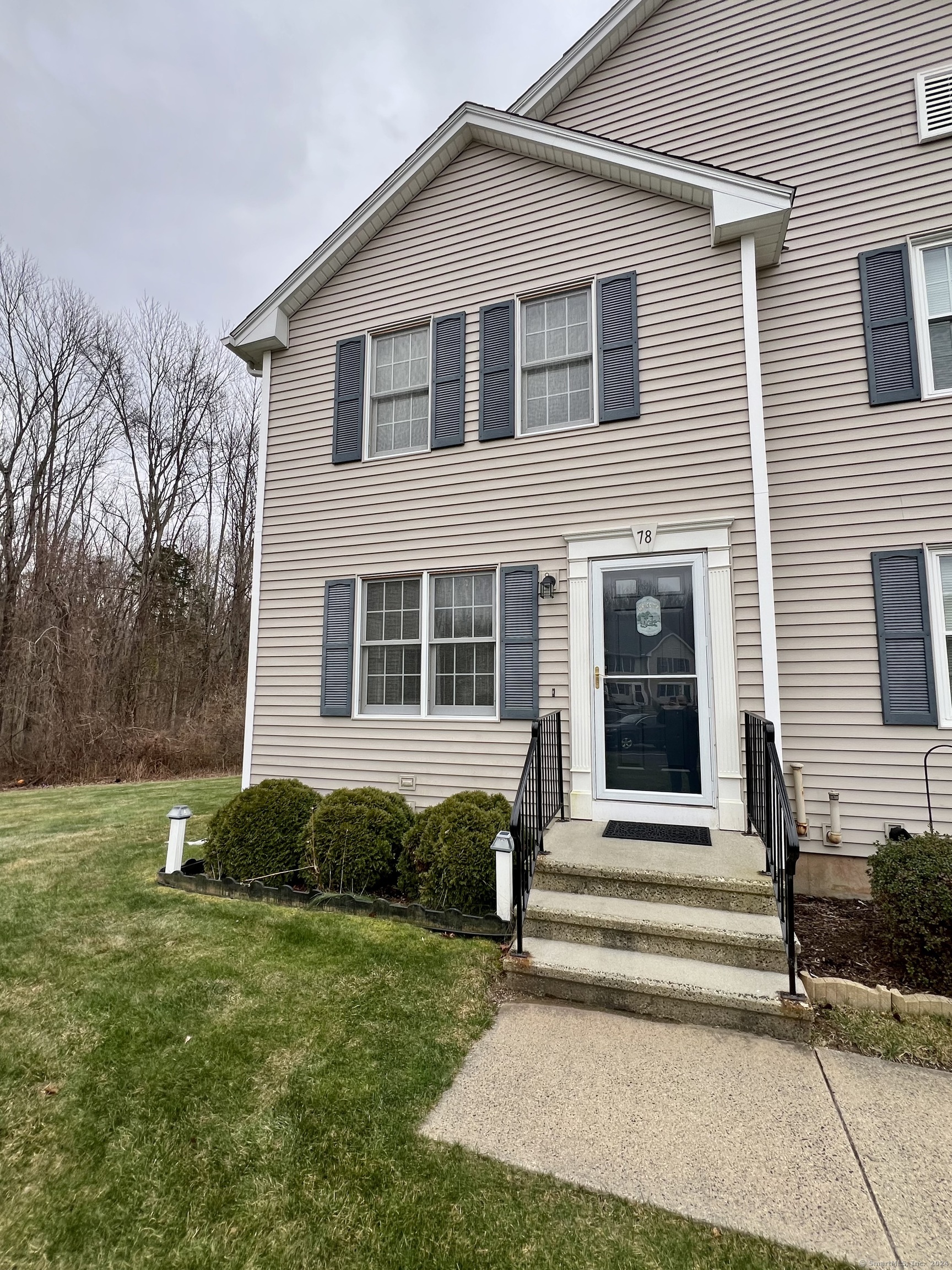 a front view of a house with a yard