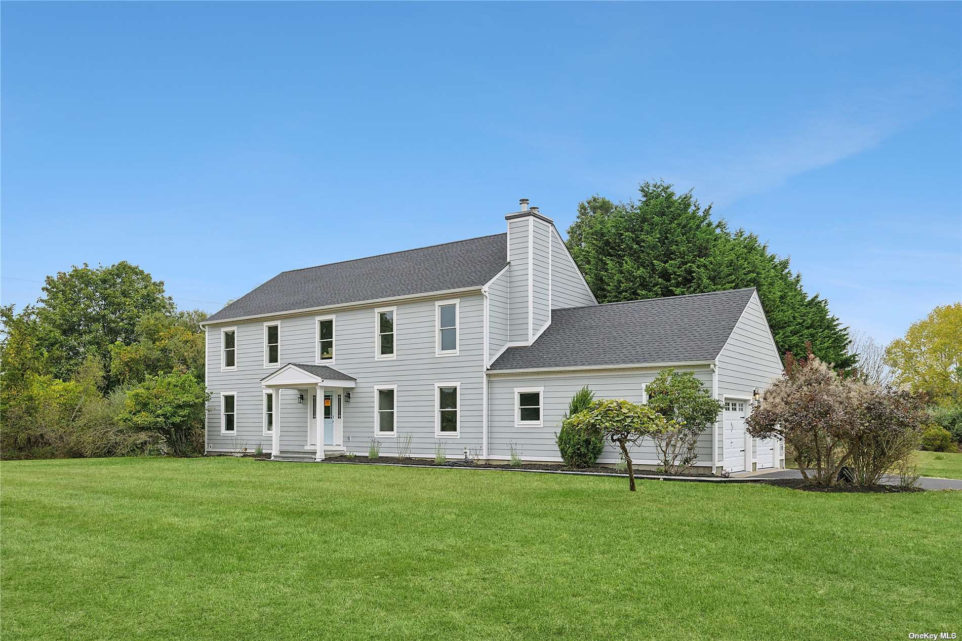 a view of a house with a big yard