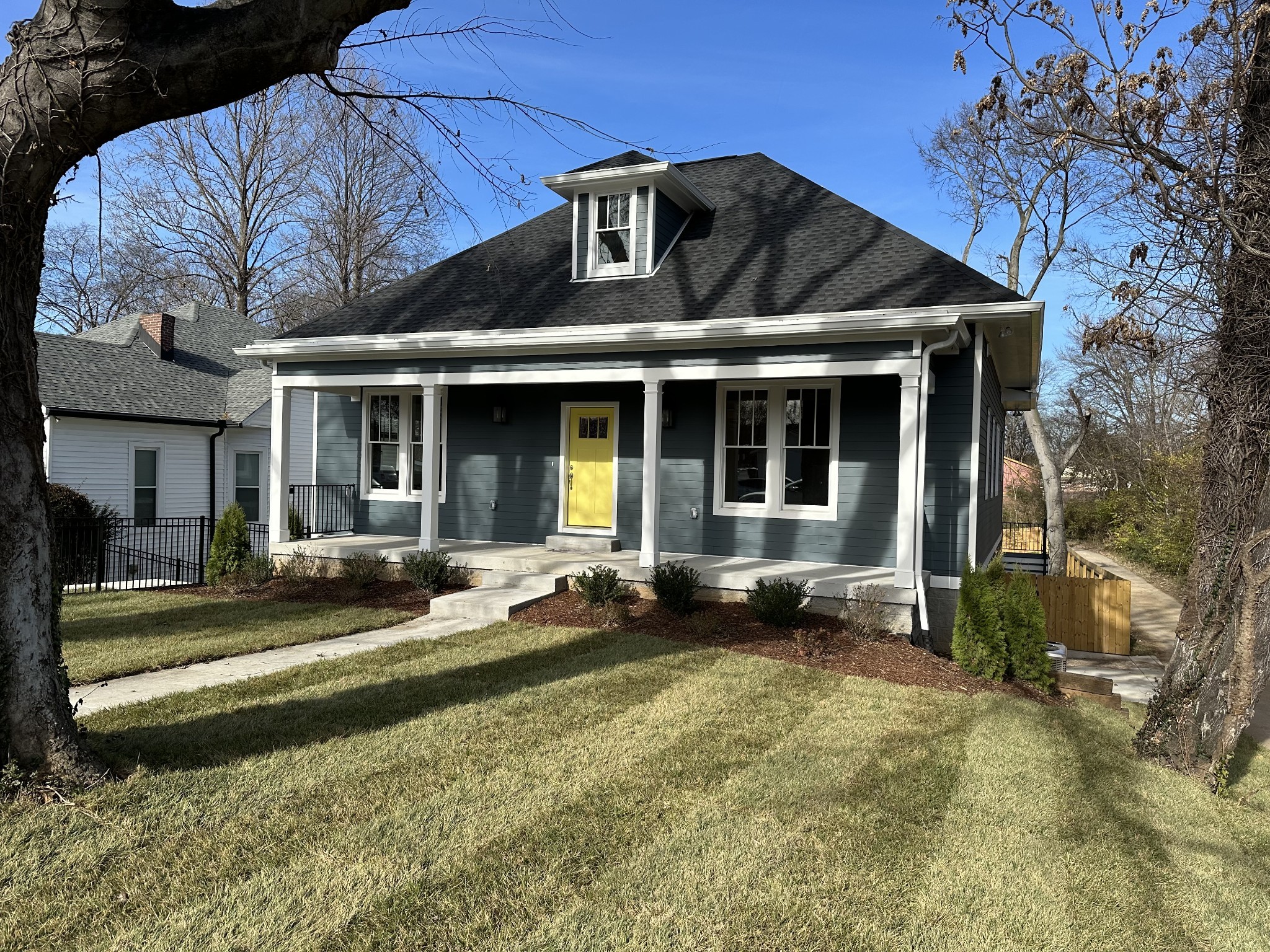 a front view of a house with a yard