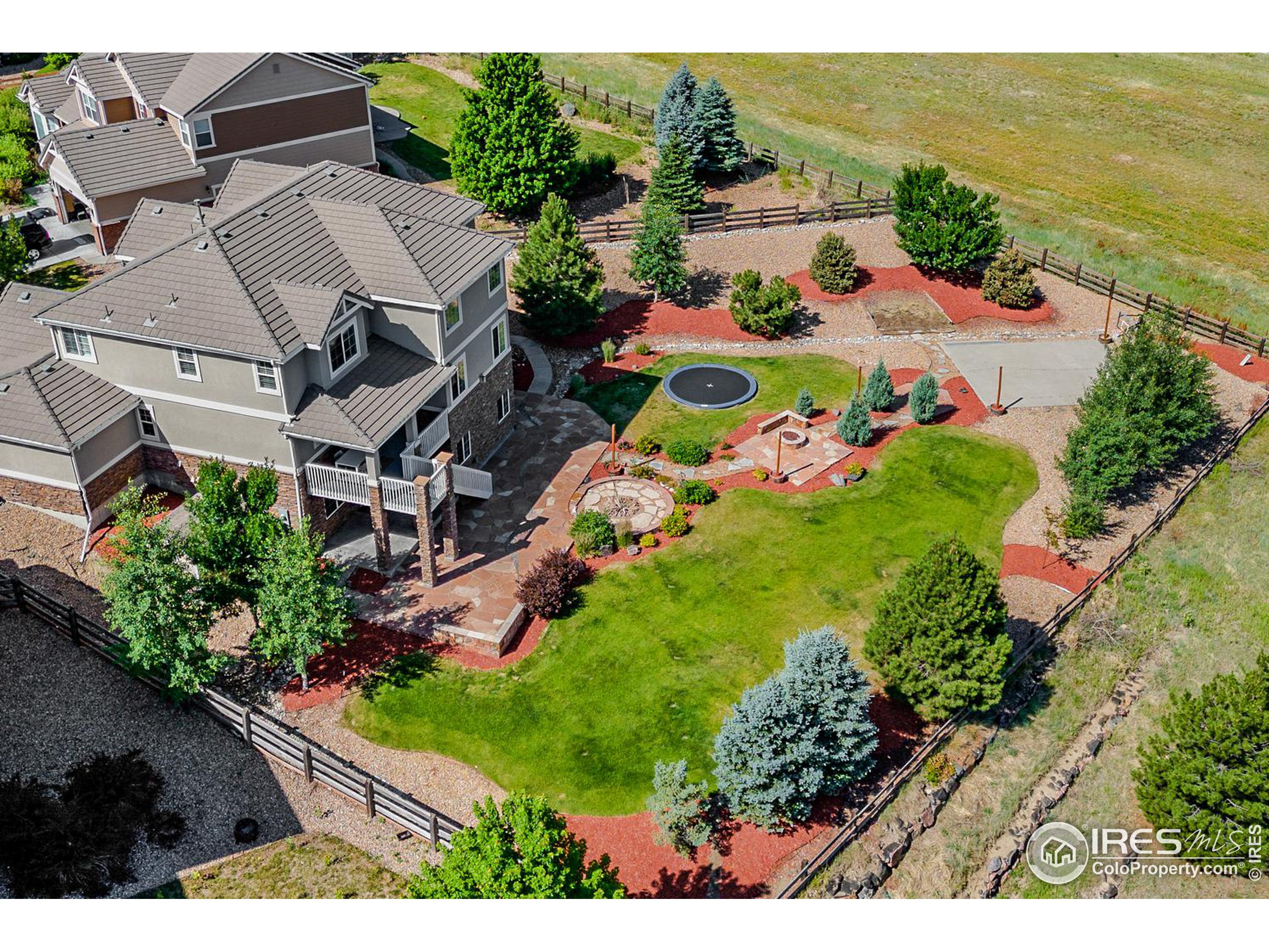 an aerial view of house with yard swimming pool and outdoor seating