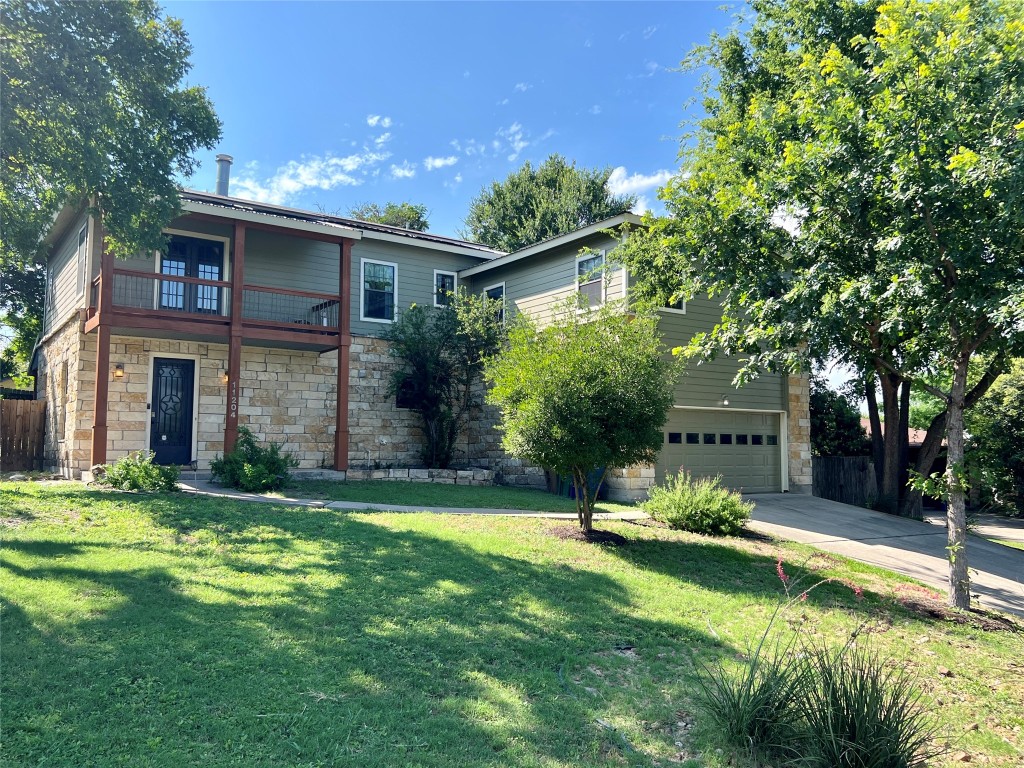 a view of a house with a yard porch and sitting area