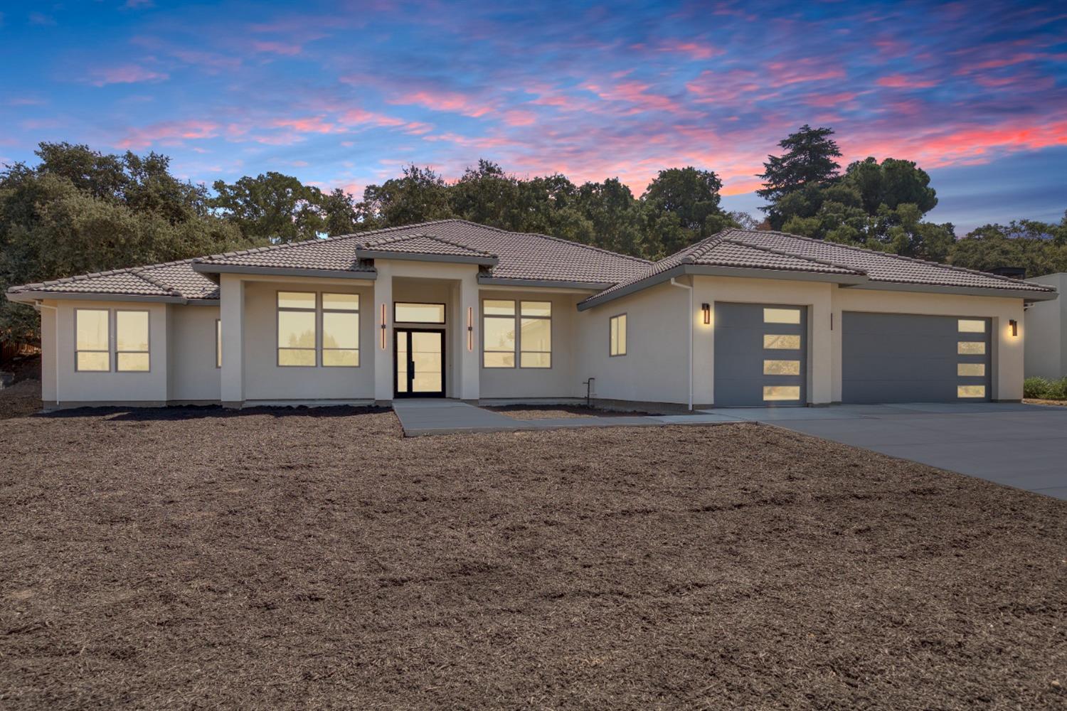 front view of a house with a yard