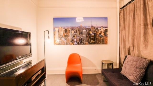 a view of a living room with furniture and a flat screen tv