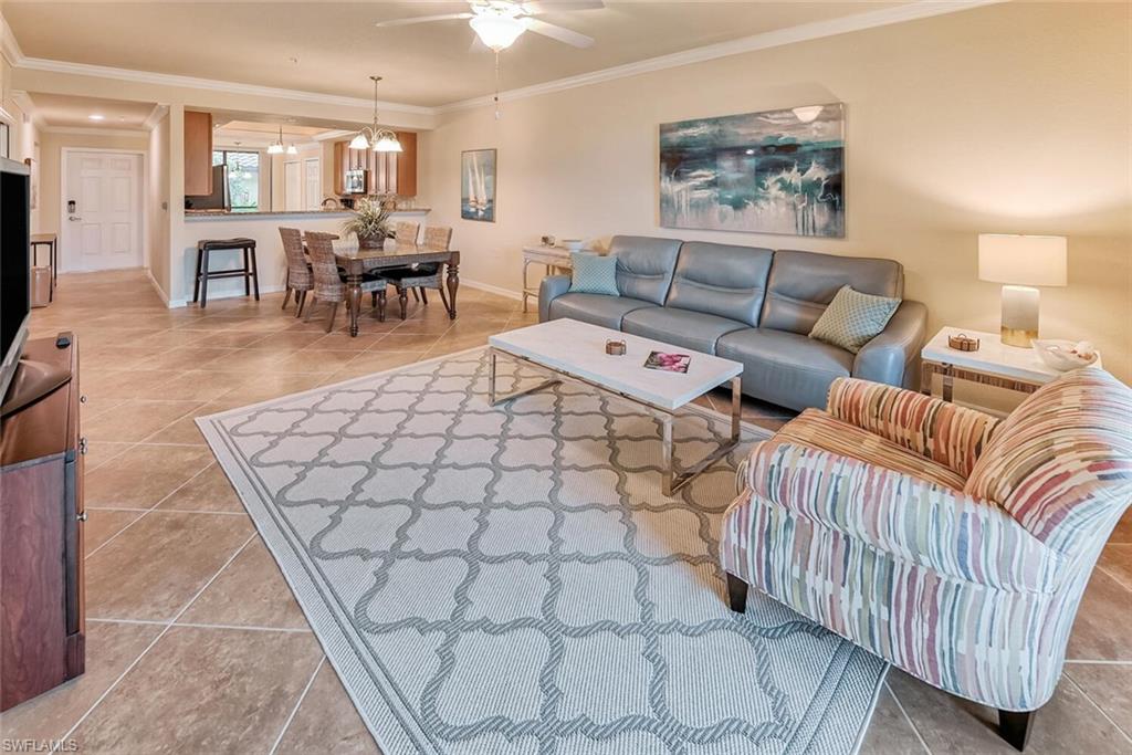 a living room with furniture and a table