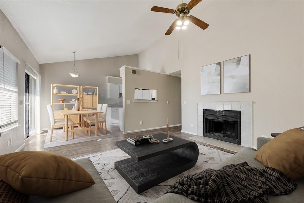 a living room with furniture and a fireplace