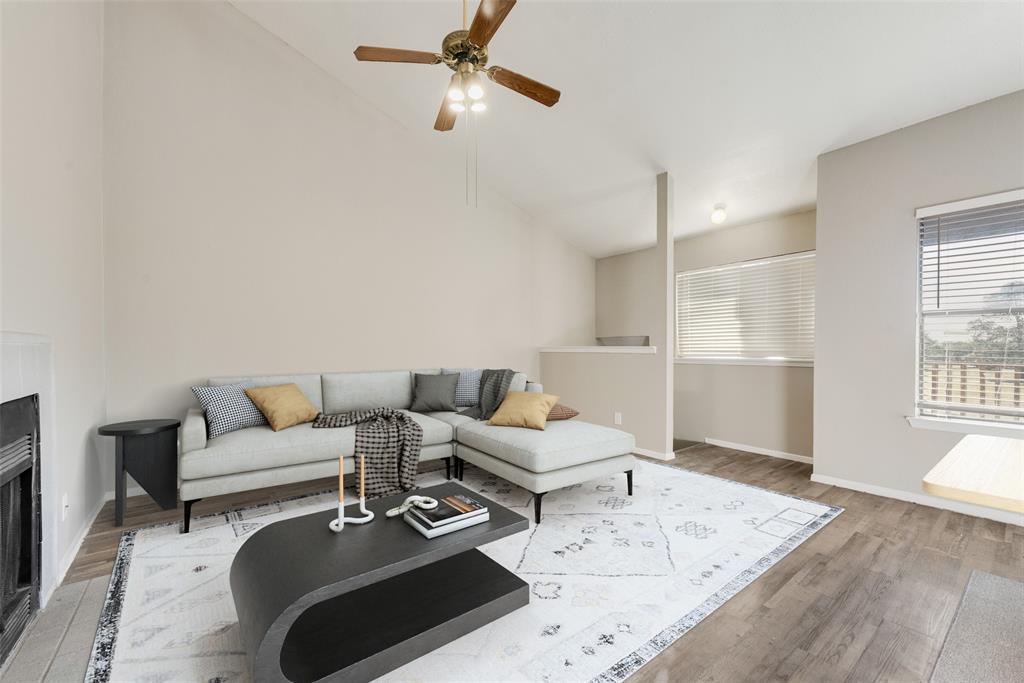 a living room with furniture and a rug