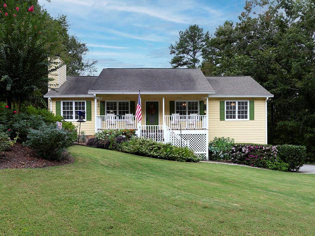 a front view of a house with garden