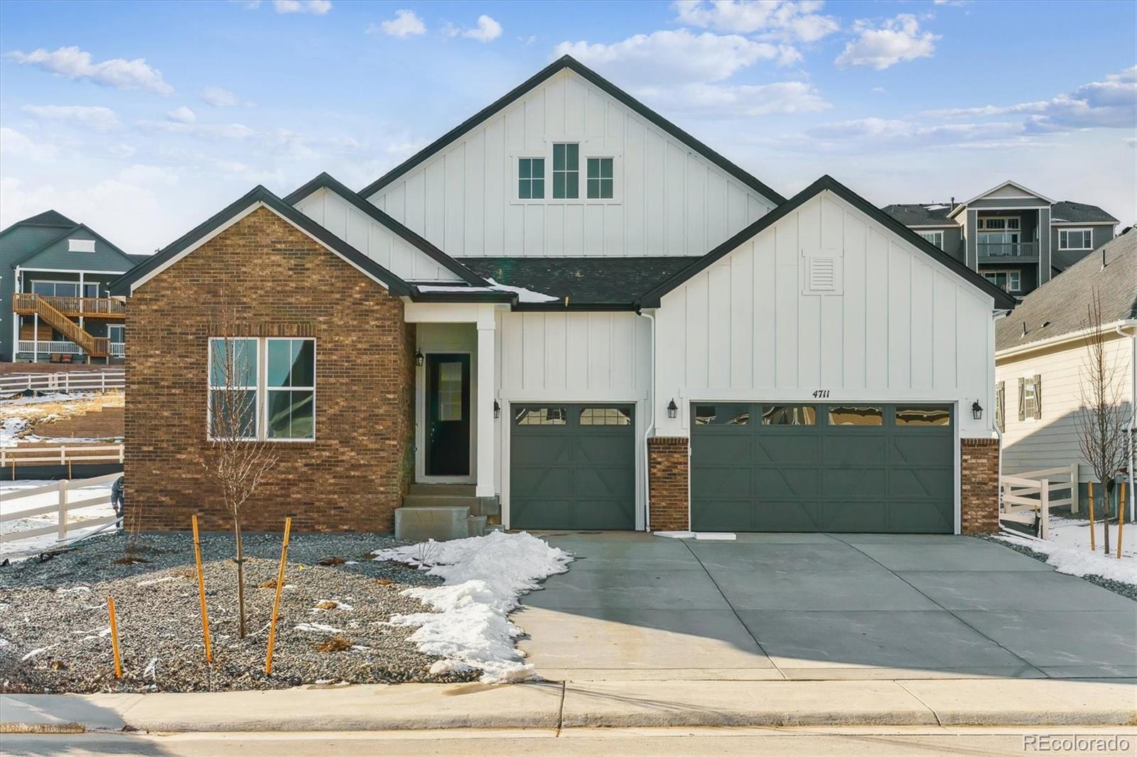 a front view of a house with garage