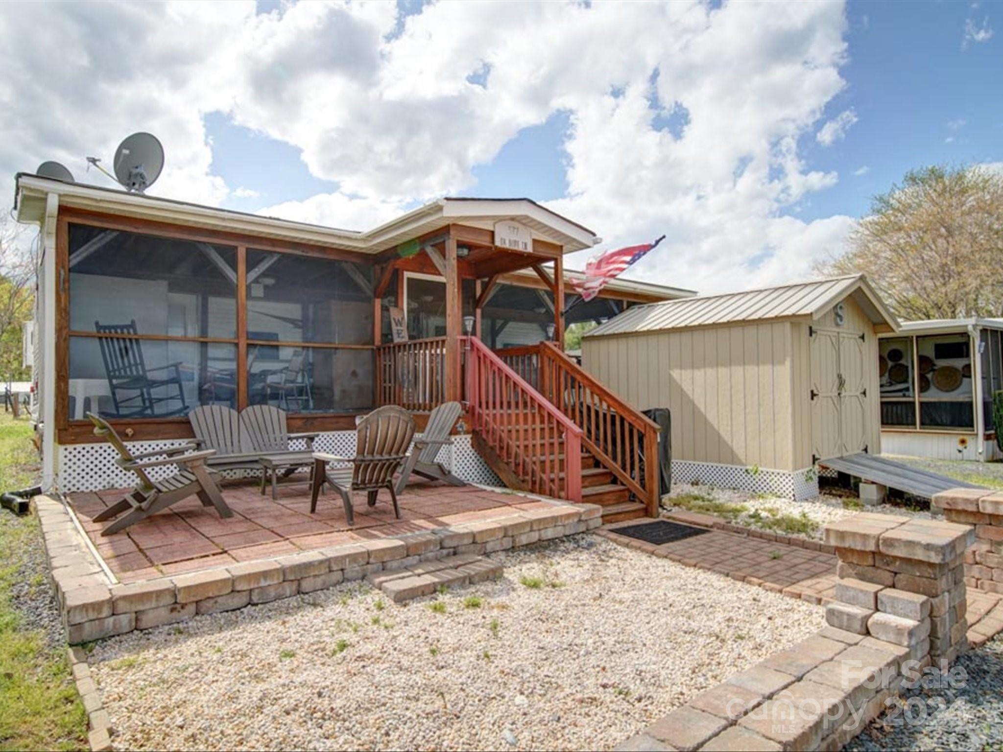 a view of house with outdoor seating area