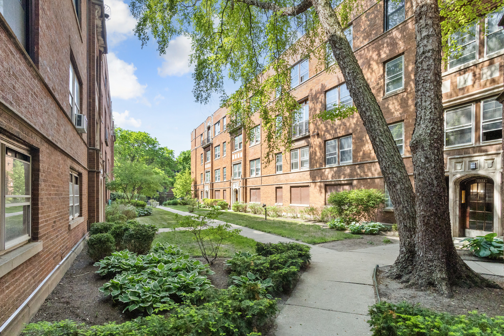 a view of a building with a garden