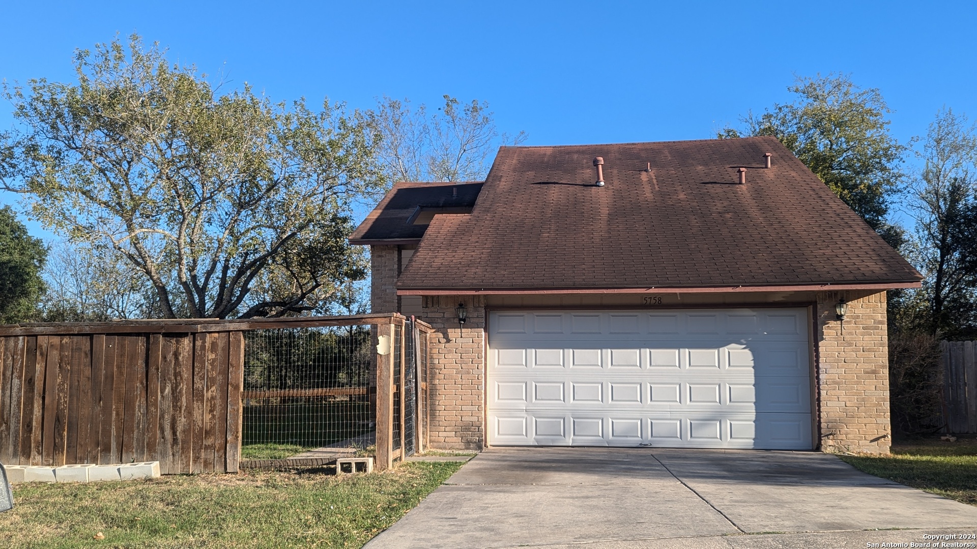 a front view of a house with a garage