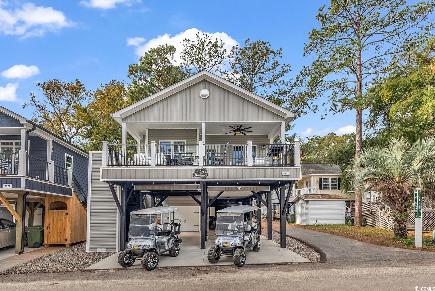 View of front of property featuring ceiling fan an