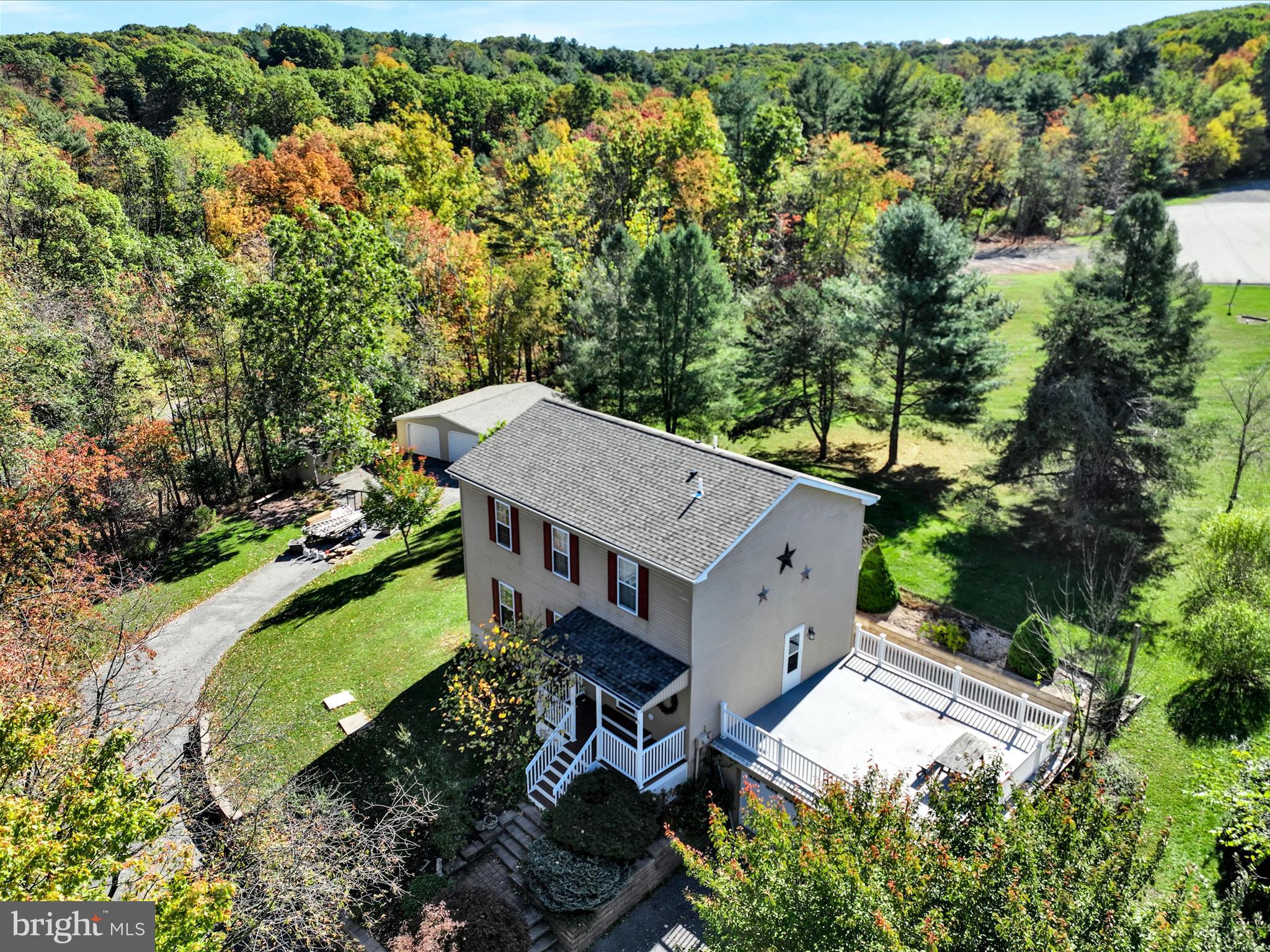 an aerial view of a house with a garden