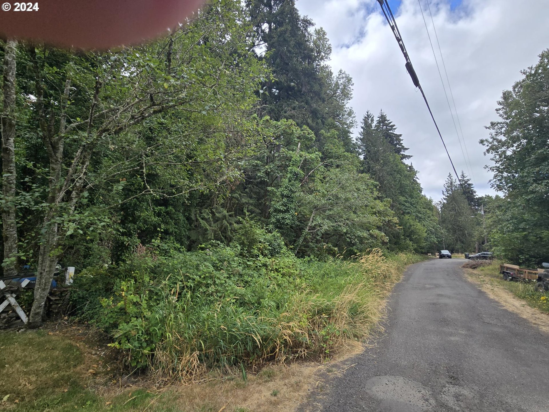 a view of a street with trees