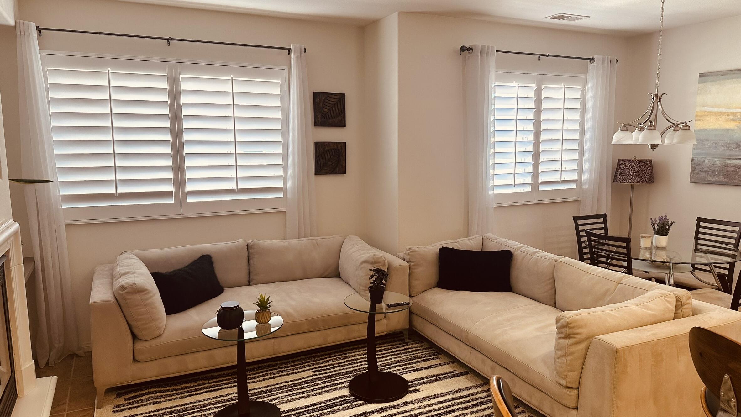 a living room with furniture and a window