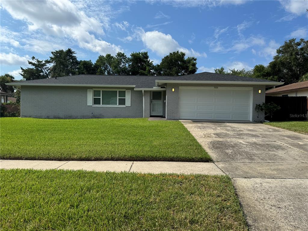 front view of a house with a yard