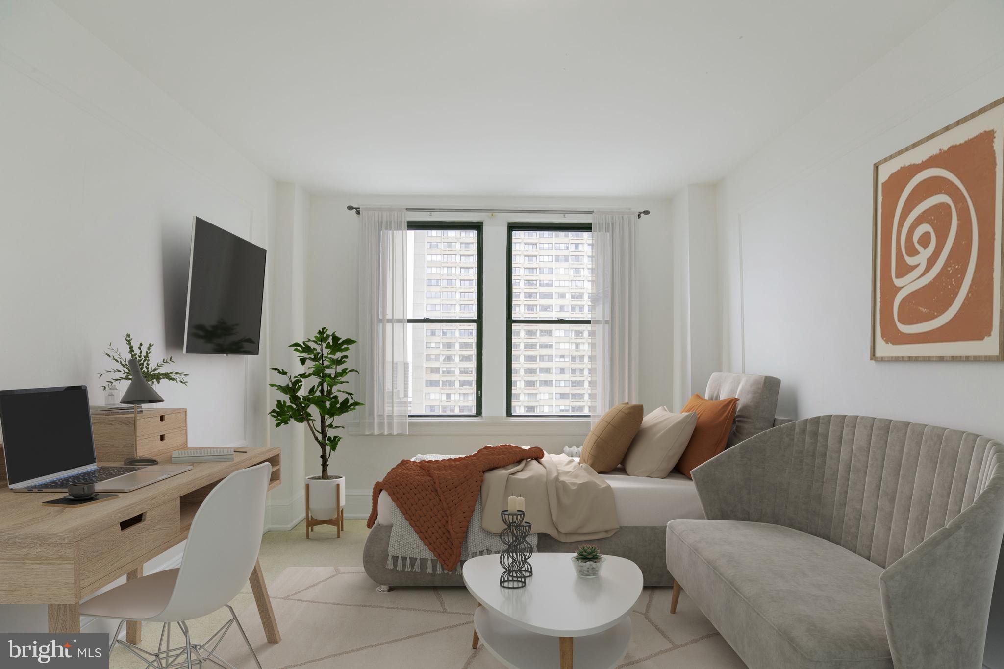 a living room with furniture and a flat screen tv