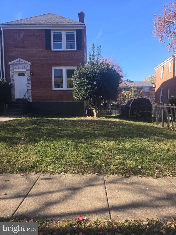 a large brick building with a yard