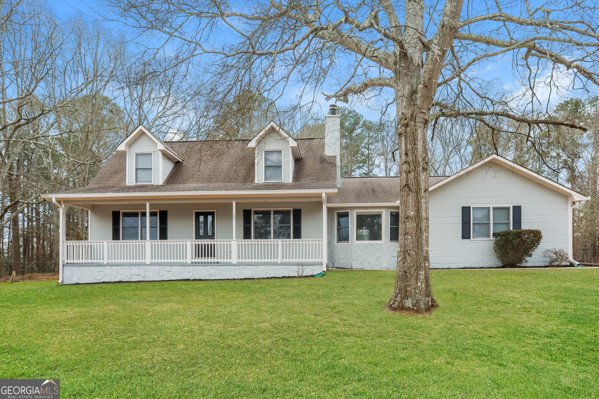 front view of a house with a yard