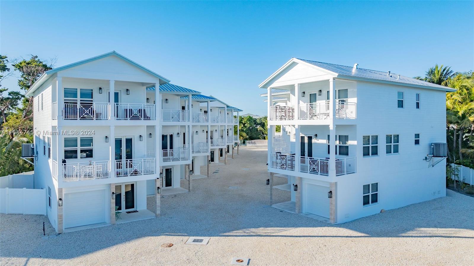 a view of front of house with a deck